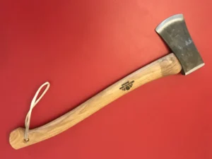 Axe rebevel and sharpened in Halifax, lying on a red background