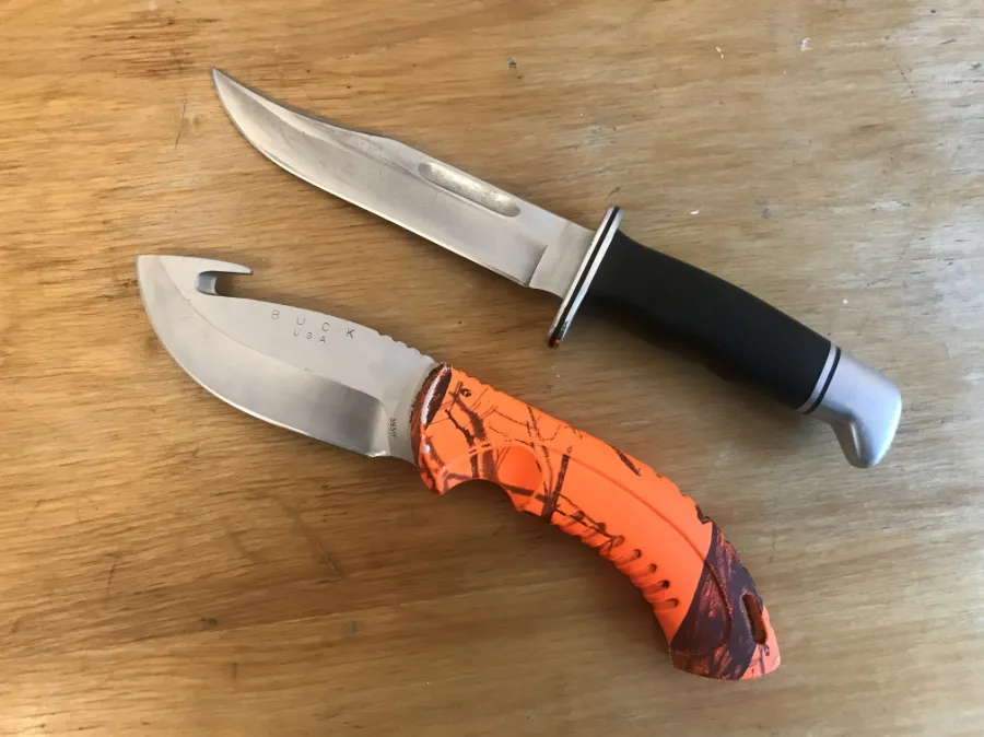 Hunting knife and EDC knife sharpening Halifax sharpened hunting knives, pocket knives and EDC knives on a wooden background