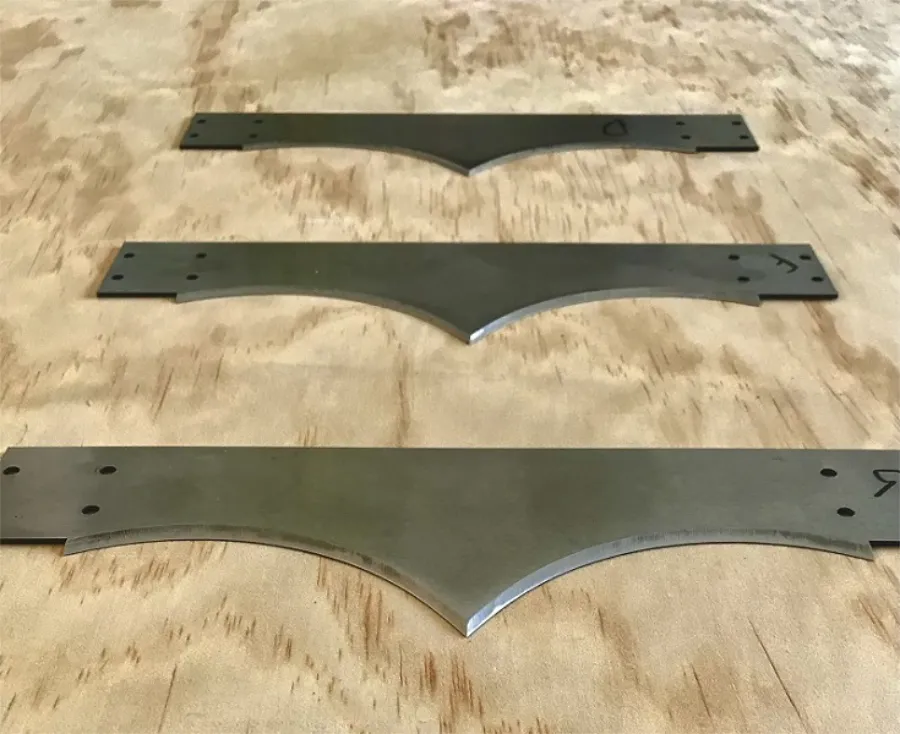 Specialized Industrial Blade sharpening Halifax specialized blades can be sharpened in Halifax by Maritime Sharpening. 3 oddly shaped blades lying on a wooden table
